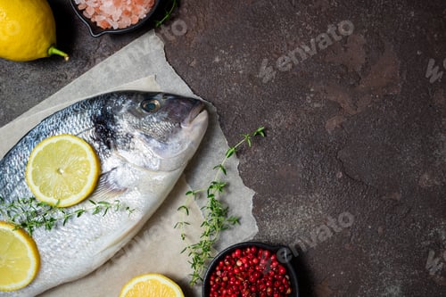 Preview: Fresh fish dorado and ingredients for cooking. Raw fish dorado with aromatic spices