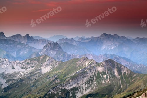 Preview: red sunrise over mountain peaks
