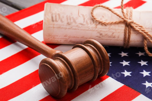 Preview: Close-up gavel with scroll and usa flag.