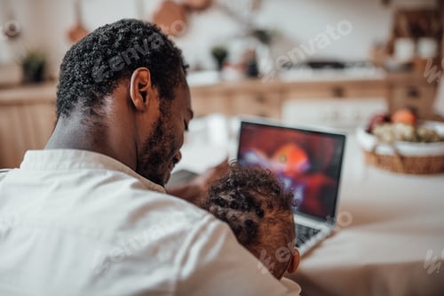 Preview: Father and Child Bonding Over Computer