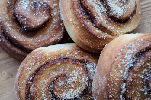 Preview: High angle close up of freshly baked cinnamon rolls.