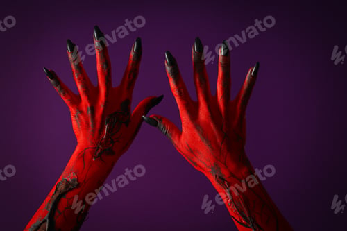 Preview: Creepy, red hands of a monster with black nails