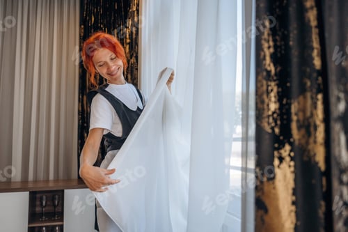 Preview: Maid is working in modern hotel room