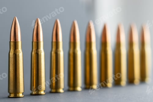 Preview: Bullets on gray background. Cartridges 7.62 caliber for Kalashnikov assault rifle