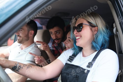 Preview: Group of friends travel together driving a car and making fun.