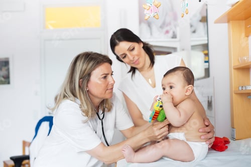 Preview: Baby (2-5 months) being examined by doctor