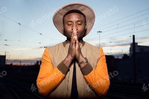 Preview: Fashion young man posing with a trendy outfit in the street.