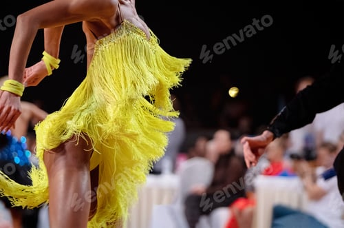 Preview: graceful female dancer in yellow dress at dance sport