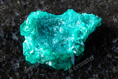 Preview: sample of raw dioptase mineral on black granite