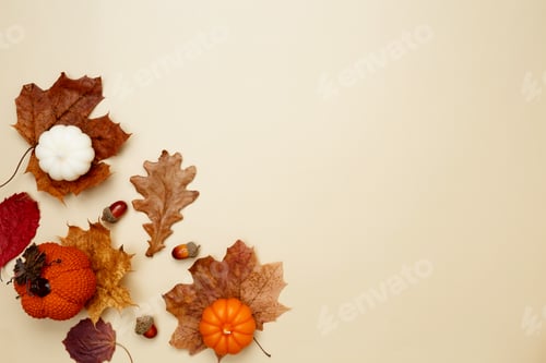 Preview: Autumn composition with maple leaves, decorative pumpkins and candles. Top view. Copy space