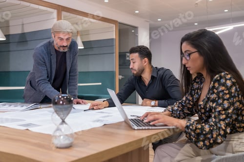 Preview: Coworkers working against the deadline of a project