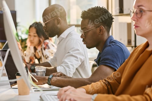 Preview: Programmers writing codes on computers