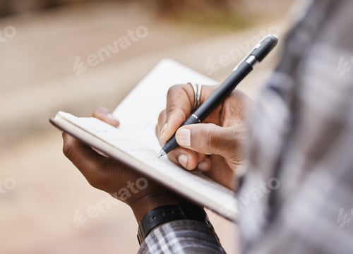 Preview: Knowledge is power. Cropped shot of a man writing in a notebook on campus.