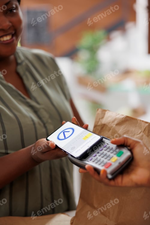 Preview: Woman buying produce with mobile payment