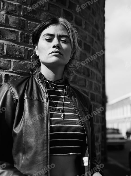 Preview: Arrogant mixed race woman in a black and white portrait.