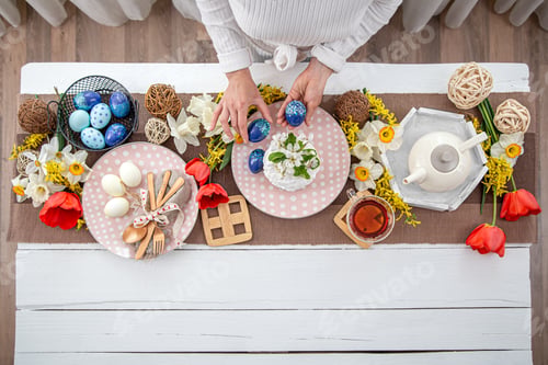 Preview: Festive table setting and table decor for Easter top view.