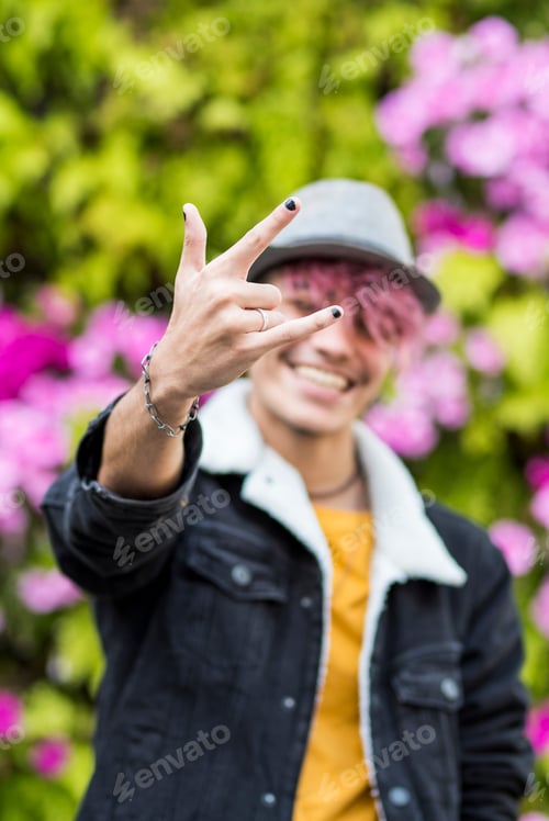 Preview: Happy cheerful handsome trendy alternative young man teenager portrait smiling on camera