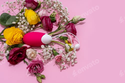 Preview: Vibrator adult toy with delicate flowers on a pink backdrop