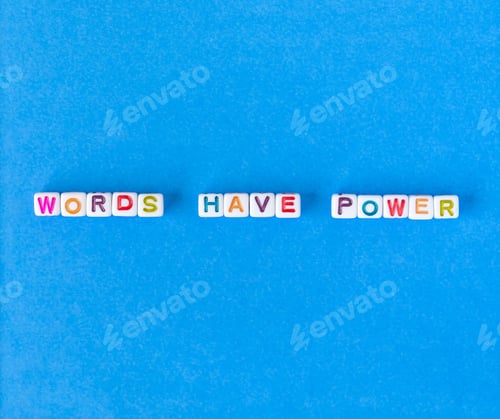 Preview: Words have power, flatlay on blue background