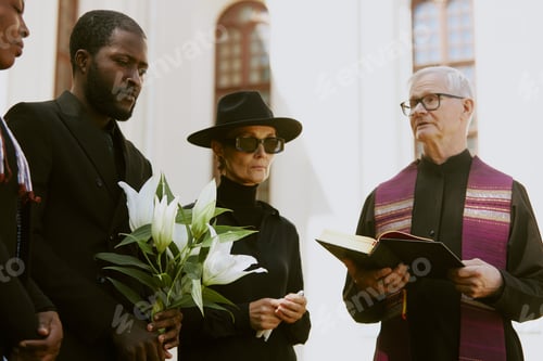 Preview: Priest Reading Prayer during Funeral