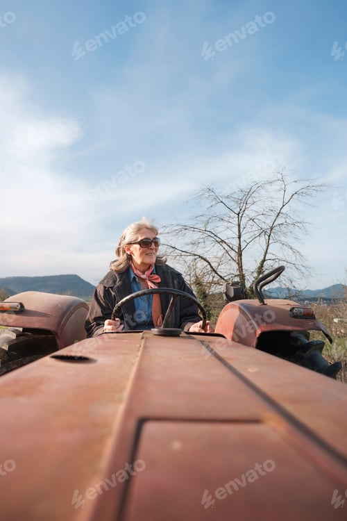 Preview: Woman Driving Vintage Tractor on Rural Farm