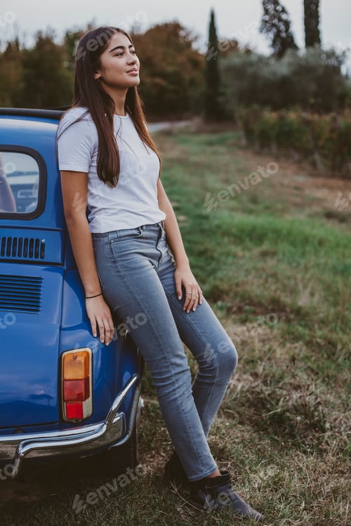 Preview: Portrait of woman leaning against car in countryside, Florence, Toscana, Italy