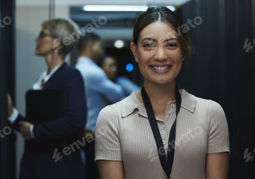 Preview: Portrait of a young beautiful woman working in server room