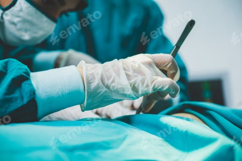 Preview: Medical team of surgeons in hospital doing invasive surgical interventions