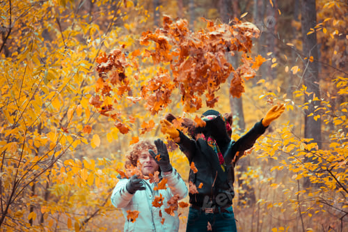 Preview: Autumn Park. Couple Throwing Yellow Leaves