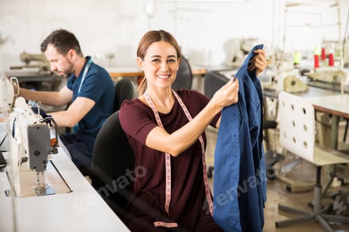 Preview: Female tailor enjoying her work
