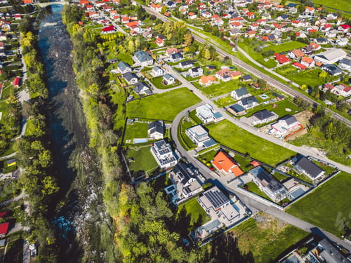Preview: Aerial photo of suburban community with river running trough