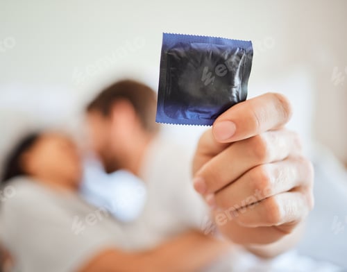 Preview: Condom, safety and safe sex with couple in bed, foreplay and intimate bonding in their home togethe