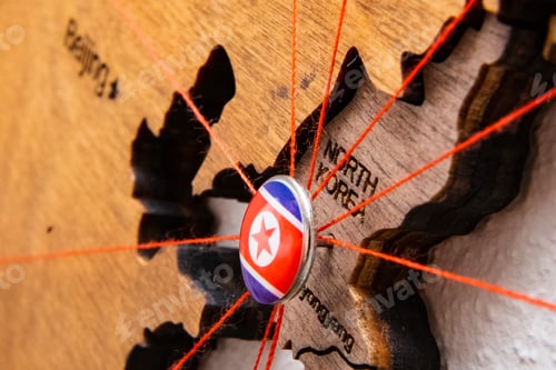 Preview: North Korea flag pins and red thread for traveling and planning trip.