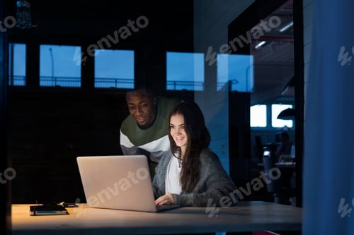 Preview: Colleagues working on laptop