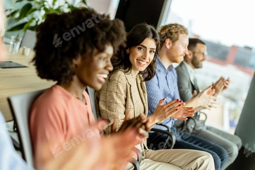 Preview: Energetic applause by a diverse group at a casual indoor event