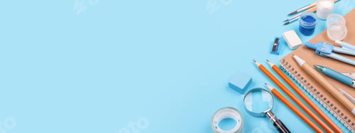 Preview: Notebook, Pens, Pencils and Other Stationary on Blue background.
