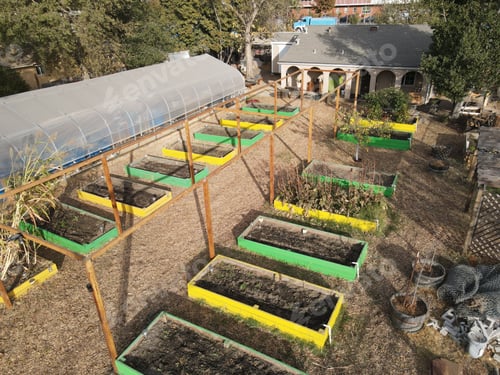 Preview: Small farm with colorful greenhouses