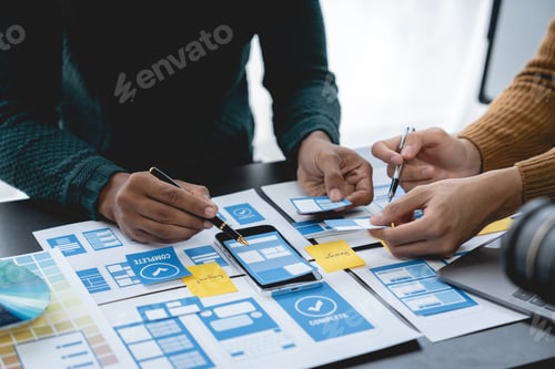 Preview: ux developers, UI designers Asian group data researchers brainstorm on tabletop mobile app interface