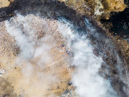 Preview: Aerial view of landfill with burning trash piles