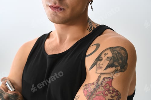 Preview: Stylish young man with tattoo showcasing modern fashion and confidence