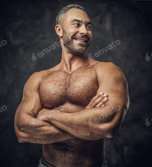 Preview: Adult caucasian muscular bodybuilder in a studio