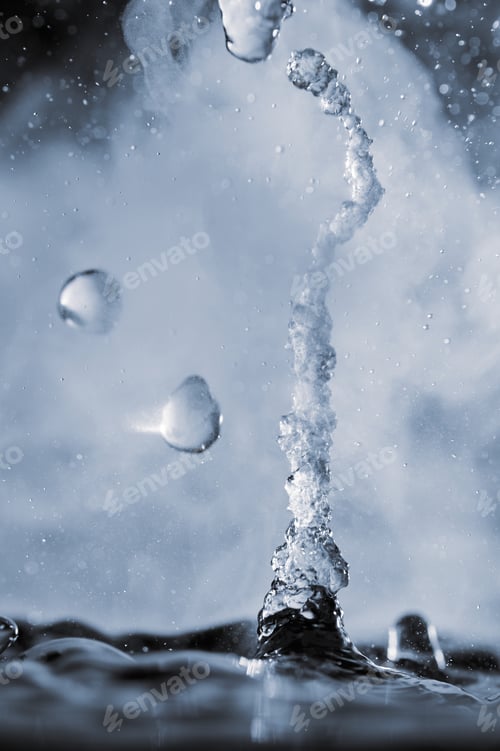 Preview: Boiling water splash with steam on black background closeup