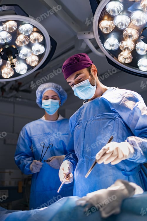 Preview: Surgeons Wearing Masks Performing a Surgical Operation