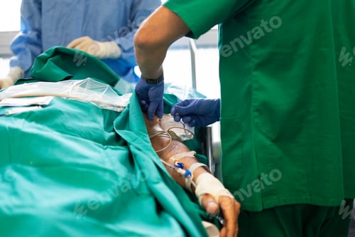 Preview: Medical professional giving intravenous therapy to patient