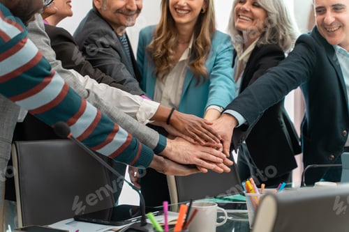 Preview: United diverse business team joining hands together
