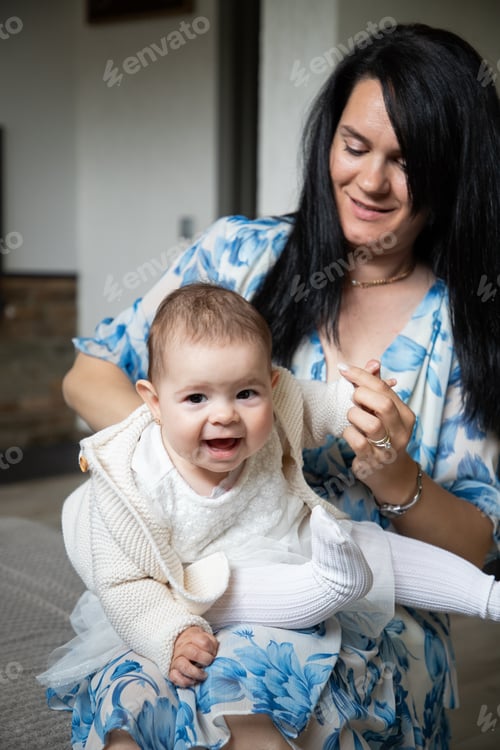 Preview: baby girl with mother at home