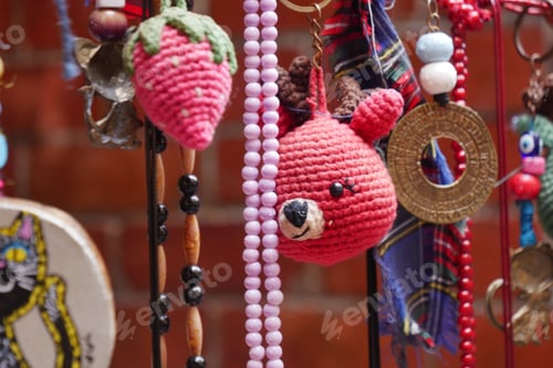 Preview: Colorful handmade keychains and accessories displayed in a market