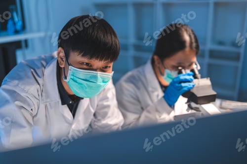 Preview: researcher working in laboratory for medicals science research using scientific equipment technology