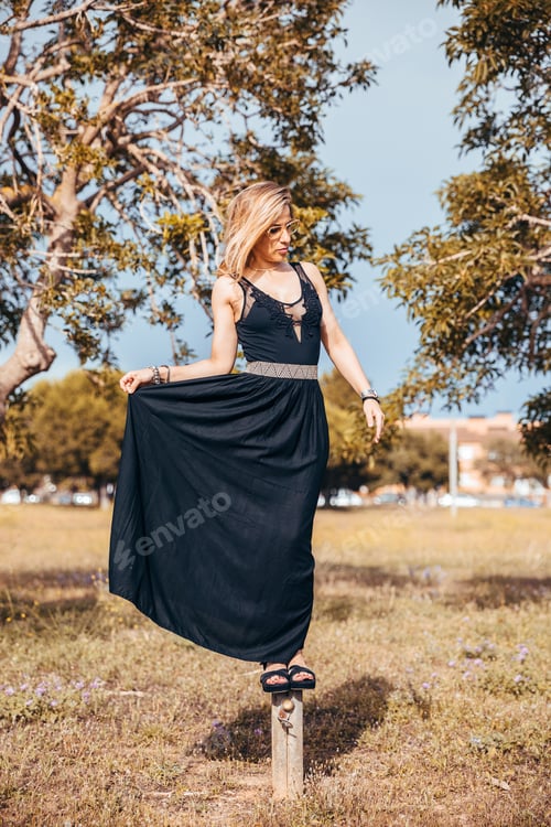 Preview: Blonde girl posing on a stick