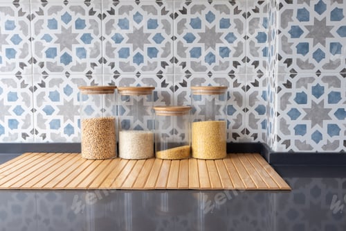 Preview: Storage jars with grains and rice on dark kitchen countertop